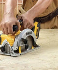 Boss Level 20V Cordless Drill Driver Kit With Compact Circular Saw shown in use on wood, featuring ergonomic handles and high-performance motor.