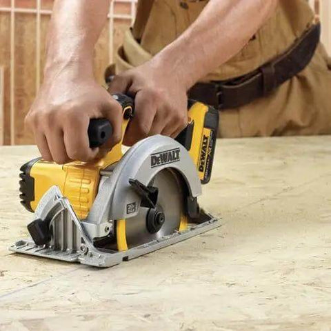 Boss Level 20V Cordless Drill Driver Kit With Compact Circular Saw shown in use on wood, featuring ergonomic handles and high-performance motor.