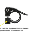 Close-up of black aluminum 28.6mm bike seat post clamp for 25.4mm post, quick release lever shown.