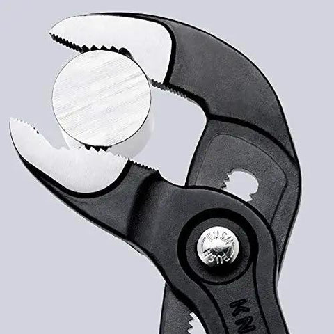 Cobra Water Pump Pliers 7 And A Quarter Inch Beefy Self Locking Pliers gripping metal pipe close-up