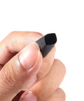 Close-up of a hand holding black tubing from 127 Piece Heat Shrink Tubing Set With 2 To 1 Shrink Ratio Assorted Black And Red Tubing In 7 Sizes