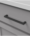 Solid Core Cabinet Pulls 10 Pack Matte Black Handles For Doors And Dressers Luxury Kitchen Hardware 6 5 Sixteenths Inch Hole Center Heavy Duty Skylight Collection installed on a gray cabinet drawer.