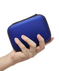 Hand holding compact blue case for Snake Bite And Sting First Aid Kit For Hiking And Camping With Venom Extractor Suction Pump