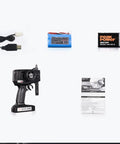 Heng Long 2.4G RC Fire Fighting Boat remote, 7.4V LiPo battery, USB charger, manual, and accessories set displayed