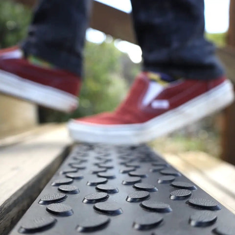 Non Slip Outdoor Stair Treads 4x24 Inch Diamond Textured Rubber Mats for Steps with red shoes stepping on surface