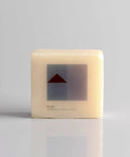 Close-up of a product box labeled 'Inkjet Waterslide Decal Paper' with minimalistic design in grey and red on a neutral background.