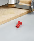 Red clamp from Six Pack Aluminum Workbench Dog Clamps With Low Profile Design Scratch Resistant Surface Easy Install Woodworking Table Stops For Pro Craftsmen