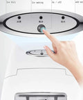 User operating the controls of a Reliable Countertop Ice Maker Machine Produces Straight Up Fast Round Cubes In Just Seven Minutes.