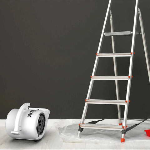 High Velocity Air Mover Super Fan Max One Fifth Horsepower For Fast Room Cooling next to a ladder on gray background