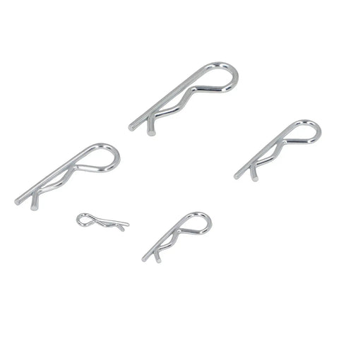 Five stainless steel hairpin cotter pins from 100pcs Stainless Steel Hairpin Cotter Pin Clip Kit With Resealable Storage Case For Heavy Duty Automotive And Industrial Machinery Applications Pro Grade Secure Hold scattered on a white surface.