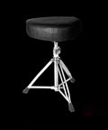Straight Up Heavy Duty Drum Throne With Motorcycle Style Seat Universal Music Piano Guitar Stool Built For Gig Musicians Adjustable Height Rock Solid Frame In Matte Black on a tripod base with rubber feet.