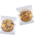 Clear Self Sealing Cookie Bags 5x6 Inch 100 Pack Sweet Gift Packaging For Cookies Treats Candy Party Favors Cellophane Bags With Strong Self Adhesive Closure 1.4 Mil Thick 13x15 Cm showcasing cookies inside.