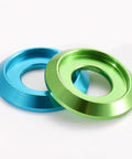 100-Piece Set of Badass M6 Titanium Gray Aluminum Grooved Washers Featuring a Sick Metallic Glow and Serious Durability with a Thin Gasket Profile Perfect for Tough Jobs in Your Garage in blue and green colors.