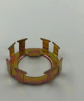 Top-down view of bronze-colored metal spindle nut retainer ring with eight rectangular tabs for EZ-Lube Dexter axle.