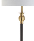 Close-up of 61 Inch Black And Brass Gold Metal LED End Table Floor Lamp with white linen drum shade and brass accent.