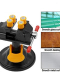 Mini Table Vise With Suction Base, 360 Degree Rotating Clamp, 0 to 25mm Jaw, shown with smooth glass surface and desktop