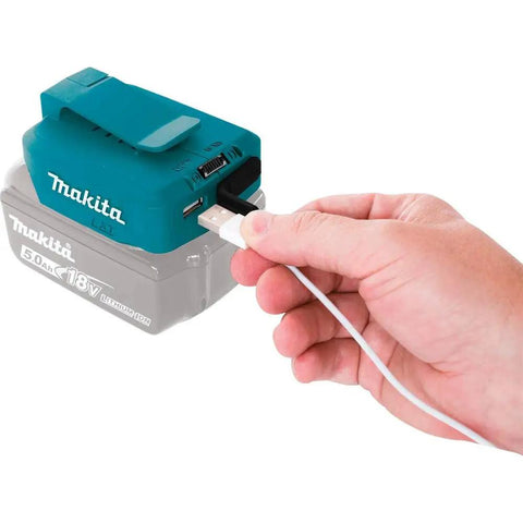 Hand plugging USB cable into 18V LXT Cordless Power Source With Dual USB Ports, 4.2A Total Output, Portable Charger