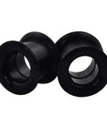 Close-up of black silicone ear tunnels from 26 Piece Silicone Ear Tunnels Set 8G To 1 Inch Hollow Flexible Soft Ear Stretching Kit for sports