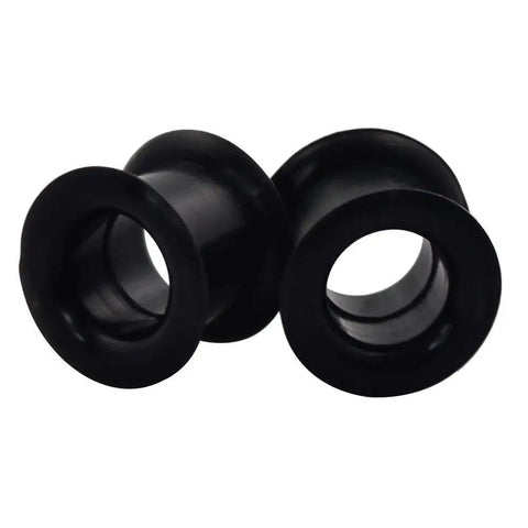 Close-up of black silicone ear tunnels from 26 Piece Silicone Ear Tunnels Set 8G To 1 Inch Hollow Flexible Soft Ear Stretching Kit for sports