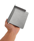 Built Damn Tough Waterproof Stainless Steel EV Charger Protective Housing hardcore outdoor box cover held in hand.