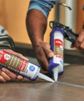 Two people applying Waterproof Kitchen And Bathroom Silicone Caulk White 10 Oz 1 Pack Strong Adhesion on a countertop.