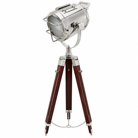 Chrome Spotlight Floor Lamp With Brown Wood Tripod Adjustable Height Studio Searchlight Lit Vintage Rustic Decor For Living Room Or Office Nautical Inspired Showpiece And Gift Idea with a chrome finish and wooden legs.