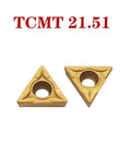 Two gold carbide turning inserts TCMT21.51 with center hole, triangular shape, front view