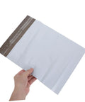 White Poly Mailer Bags 100 Pack 10x14 Inch Waterproof Self Seal Envelopes For Shipping Clothes And Mailing Supplies held in hand