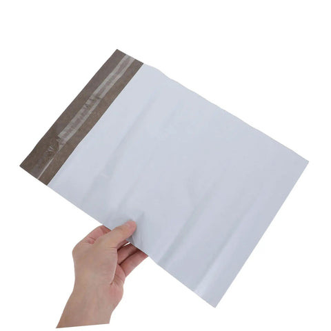 White Poly Mailer Bags 100 Pack 10x14 Inch Waterproof Self Seal Envelopes For Shipping Clothes And Mailing Supplies held in hand