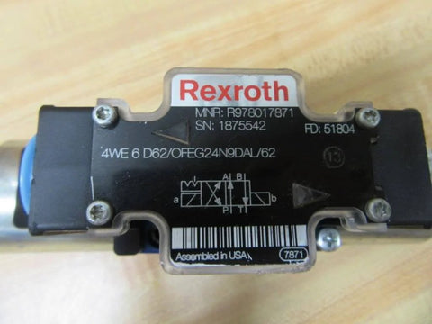 Close-up of a hydraulic directional control valve 4WE 6 D62/OFEG24N9D K25L/62 PN R978017871 with label and connector view