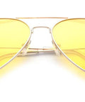 Top Shelf Anti Glare Night Vision Polarized Aviator Sunglasses Decked Out In Sleek Gold Frames And Bright Yellow Lenses laid flat.