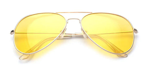Top Shelf Anti Glare Night Vision Polarized Aviator Sunglasses Decked Out In Sleek Gold Frames And Bright Yellow Lenses laid flat.