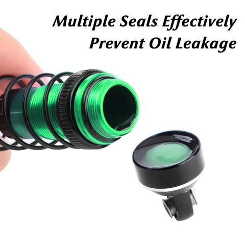 Green aluminum shock absorber with seals preventing oil leakage for 1/16 Mini Maxx and Mini XRT trucks. Front end detail.