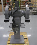 Shop Beast 12 Inch Bench Grinder with 3 Horsepower 3 Phase Motor, front view on pallet, grey steel design, industrial use.