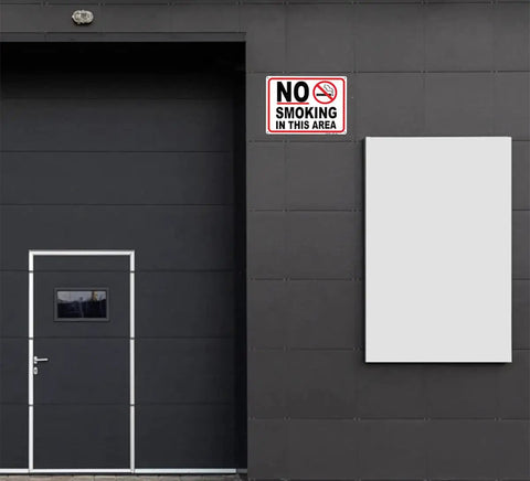 No Smoking Sign 10 x 14 Inch Aluminum No Vaping Sign 4 Pack mounted on dark wall outside a door