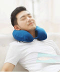 Man relaxing with Memory Foam Travel Neck Pillow For Airplanes And Cars Breathable Compact Flight Kit For Restful Sleep Supportive