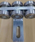 Pro Level Electric 6 Wheel Track Roller For 1 5/8 Metal Studs showing six hardened casters on metal frame for alignment tool.