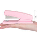 Pink Office Desktop Stapler With 25 Sheet Capacity And Holds Up To 120 Staples shown on a hand for size reference, 2.1 inches tall.