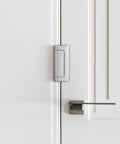 Kick Resistant Door Reinforcement Lock, 2 Pack Heavy Duty Security Strike Plate Mounted on White Door for added security.