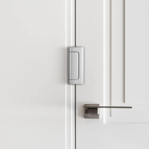 Kick Resistant Door Reinforcement Lock, 2 Pack Heavy Duty Security Strike Plate Mounted on White Door for added security.