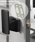 Heavy Duty Deadbolt Strike Plate Satin Nickel Backplate 1 Inch By 2-1/4 Inch Round Corner on a door with a black handle.