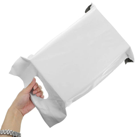 Hand holding a 100 Pack White Poly Mailer Bags Thickened Lightweight Envelopes With Strong Adhesive Seal For Clothing Shipping And Small Business Mailers Leakproof Rainproof Quick Seal Design
