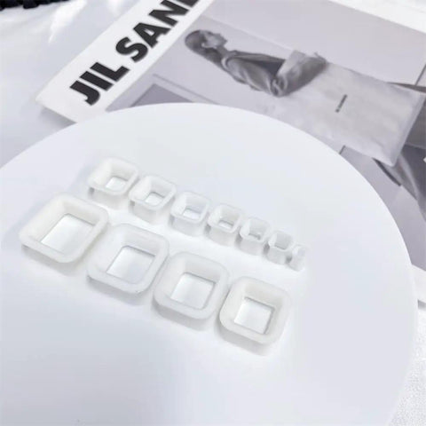 Rectangle Silicone Ear Tunnels And Plugs 00G 10MM Hollow Square Flexible Gauges Set on white surface