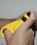 Close-up of yellow coax cable stripper from Coax Install And Test Kit With Crimp Tool, Tester, Stripper And Universal F Connectors