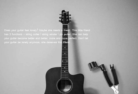 3-in-1 guitar maintenance tool with string winder, cutter and pin puller in silver beside a black acoustic guitar.