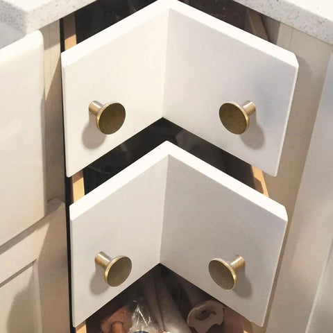 Antique Brass Cabinet Knobs 6 Pack Minimalist Round Hardware For Cabinets And Dressers 1-1/8 Inch Diameter installed on white drawers