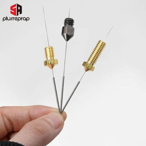 Hand holding three 0.4mm stainless steel nozzle cleaning needles with brass tips for 3D printers, ideal for Creality and similar models.