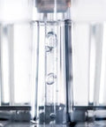 Close-up of boiling water inside stainless steel drip coffee maker mechanism, part of Stainless Steel Drip Coffee Maker With Thermal Base Keeps Your Brew Hot For Hours 1.25L Capacity Analog Hand Brewed And Automatic Filter Coffee Machine For Home Or Office Use.