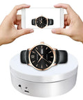 Herxsin Electric Rotating Display Stand 360 Degree Motorized Turntable With Usb Power Cable Showcase For Jewelry Watch Models And Photography Products Smooth Spin White Finish, showcasing a watch being photographed.