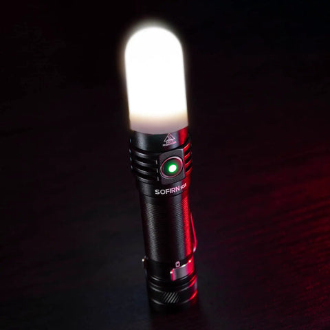 Compact EDC Rechargeable Flashlight With 1800 Lumen Output, SST 40 LED, with diffuser glowing on dark background